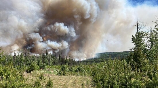 This image shows smoke from the West Kiskatinaw River and Peavine Creek wildfires in the Dawson Creek Zone, British Colombia, Canada.&nbsp;(AFP)