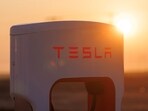 FILE PHOTO: A Tesla supercharging station is seen in the early morning sun, in Kettleman City, California, U.S., January 25, 2023.  REUTERS/Mike Blake/File Photo