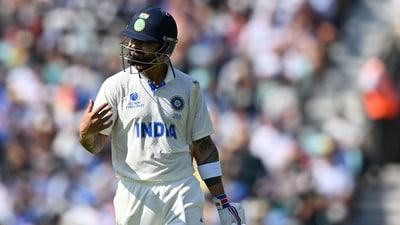 India's Virat Kohli walks back to the pavilion after losing his wicket for 14 runs during day 2 of the ICC World Test Championship cricket final match between Australia and India at The Oval. (AFP) India's Virat Kohli walks back to the pavilion after losing his wicket for 14 runs during day 2 of the ICC World Test Championship cricket final match between Australia and India at The Oval. (AFP)