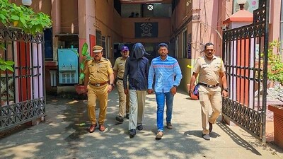 Police personnel take 56-year-old accused Manoj Sane into custody for allegedly chopping and boiling body parts of his partner. (PTI)