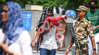 People out on a hot summer day at Connaught Place, in New Delhi on Friday. (Raj K Raj/HT) People out on a hot summer day at Connaught Place, in New Delhi on Friday. (Raj K Raj/HT)