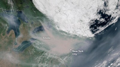 The satellite image show smoke enveloping New York City. (Nasa Earth Observatory image by Lauren Dauphin) The satellite image show smoke enveloping New York City. (Nasa Earth Observatory image by Lauren Dauphin)