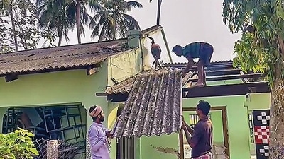 Workers at the Bahanaga High School building that was used as a temporary morgue for victims of the recent triple-train accident, in Balasore district on Friday. (PTI) Workers at the Bahanaga High School building that was used as a temporary morgue for victims of the recent triple-train accident, in Balasore district on Friday. (PTI)