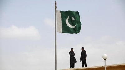 A Pakistani flag atop a building. (Reuters File) A Pakistani flag atop a building. (Reuters File)