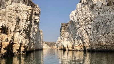 Bhedaghat: Bhedaghat is a hill station renowned for its stunning marble rocks and breathtaking waterfalls. The majestic Dhuandhar Falls, along with the awe-inspiring Marble Rocks, create a spectacle that is both captivating and serene. Take a boat ride through the marble canyon, witness the sunlight illuminating the rocks, and immerse yourself in the natural wonders of Bhedaghat. (Unsplash) Bhedaghat: Bhedaghat is a hill station renowned for its stunning marble rocks and breathtaking waterfalls. The majestic Dhuandhar Falls, along with the awe-inspiring Marble Rocks, create a spectacle that is both captivating and serene. Take a boat ride through the marble canyon, witness the sunlight illuminating the rocks, and immerse yourself in the natural wonders of Bhedaghat. (Unsplash)