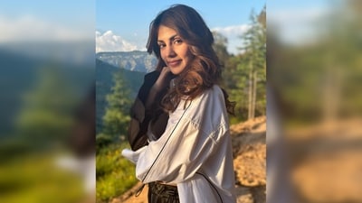 Rhea Chakraborty adorned a sporty look. She donned a black sports bra, trousers and an oversized white shirt with thin black borders. (Instagram/@rhea_chakraborty) Rhea Chakraborty adorned a sporty look. She donned a black sports bra, trousers and an oversized white shirt with thin black borders. (Instagram/@rhea_chakraborty)
