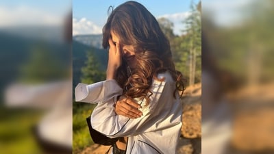 Rhea Chakraborty gets captured candidly smiling in a blushing manner with hands covering her face and hair gently falling on her cheeks. (Instagram/@rhea_chakraborty) Rhea Chakraborty gets captured candidly smiling in a blushing manner with hands covering her face and hair gently falling on her cheeks. (Instagram/@rhea_chakraborty)
