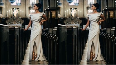 Her attire showcases an elegant white hue, adorned with an off-shoulder neckline, knot embellishment at the waist, and a wrap design on the bottom, accompanied by a front slit, adding a touch of allure to the ensemble. (Instagram/@sunnyleone) Her attire showcases an elegant white hue, adorned with an off-shoulder neckline, knot embellishment at the waist, and a wrap design on the bottom, accompanied by a front slit, adding a touch of allure to the ensemble. (Instagram/@sunnyleone)