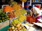 The girl landed in the lap of a fruit seller sitting outside the building