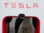 Tesla's EV charging connector is pictured at a charging station in Anaheim, California. Tesla's EV charging connector is pictured at a charging station in Anaheim, California.