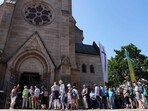 People queue for a church service in Nuremberg, Germany, Friday, Hundreds of German Protestants have attended a church service in Bavaria that was generated almost entirely by artificial intelligence. People queue for a church service in Nuremberg, Germany, Friday, Hundreds of German Protestants have attended a church service in Bavaria that was generated almost entirely by artificial intelligence.