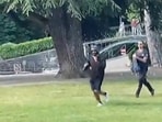 A screen grab taken from a video obtained by AFPTV on June 8, 2023 shows a man armed with a knife running away after he attacked a group of pre-school children playing by a lake in the French Alps city of Annecy. A screen grab taken from a video obtained by AFPTV on June 8, 2023 shows a man armed with a knife running away after he attacked a group of pre-school children playing by a lake in the French Alps city of Annecy.