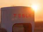 FILE PHOTO: A Tesla supercharging station is seen in the early morning sun, in Kettleman City, California, U.S., January 25, 2023.  REUTERS/Mike Blake/File Photo