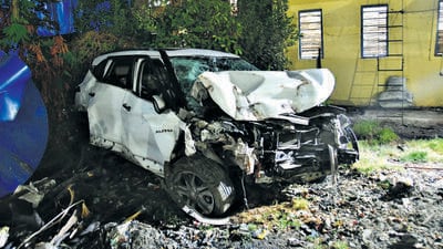 “After losing control of the vehicle, the driver rammed into the divider. The impact of the hit threw the car towards a footpath where it bumped into a huge tree. The back side of the car was completely destroyed in the accident,” the police officer added. (Bhushan Koyande/HT Photo)