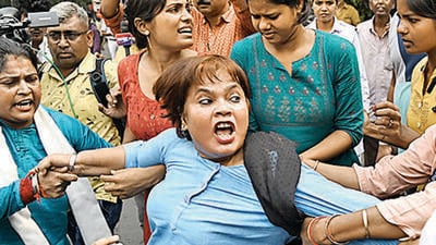 Bengal BJP chief Sukanta Majumdar (left) with governor CV Ananda Bose in Kolkata; and Congress workers stage a protest in Murshidabad, on Saturday over the violence in the state. (PTI) Bengal BJP chief Sukanta Majumdar (left) with governor CV Ananda Bose in Kolkata; and Congress workers stage a protest in Murshidabad, on Saturday over the violence in the state. (PTI)