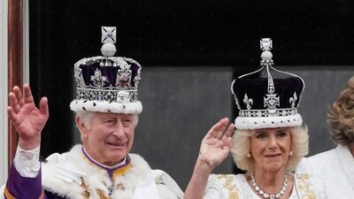 Britain's King Charles III and Queen Camilla wave to the crowds from the balcony of Buckingham Palace. (AP) Britain's King Charles III and Queen Camilla wave to the crowds from the balcony of Buckingham Palace. (AP)