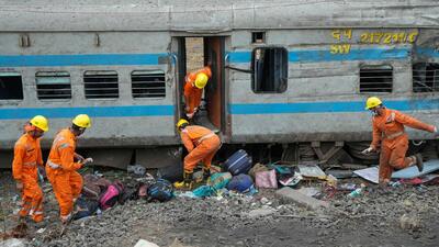 NDRF personnel during at the train accident site in Odisha’s Balasore district. (PTI) NDRF personnel during at the train accident site in Odisha’s Balasore district. (PTI)