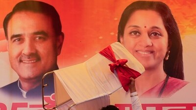 An NCP carries a chair during the party's foundation day celebrations in New Delhi, Saturday, June 10, 2023. During the programme NCP chief Sharad Pawar announced Supriya Sule and Praful Patel as working presidents of the party. (PTI)