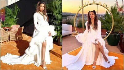 Priyanka styled the look with a hairdo inspired by the space girl aesthetic, opting for centre-parted sleek half-tied pigtails. Lastly, berry-toned lip shade, subtle eye shadow, feathered brows, rouged cheekbones, mascara on the lashes, beaming highlighter, and contoured face completed the glam picks. (Instagram) Priyanka styled the look with a hairdo inspired by the space girl aesthetic, opting for centre-parted sleek half-tied pigtails. Lastly, berry-toned lip shade, subtle eye shadow, feathered brows, rouged cheekbones, mascara on the lashes, beaming highlighter, and contoured face completed the glam picks. (Instagram)