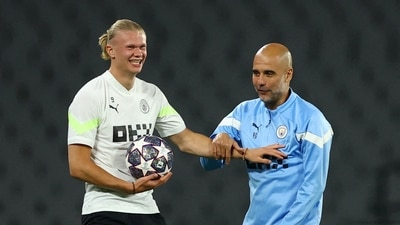 Manchester City manager Pep Guardiola with Erling Braut Haaland during training (REUTERS)