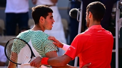 Serbia's Novak Djokovic (R) comforts Spain's Carlos Alcaraz Garfia after his victory during their men's singles semi-final match on day thirteen of the Roland-Garros Open tennis tournament (AFP) Serbia's Novak Djokovic (R) comforts Spain's Carlos Alcaraz Garfia after his victory during their men's singles semi-final match on day thirteen of the Roland-Garros Open tennis tournament (AFP)