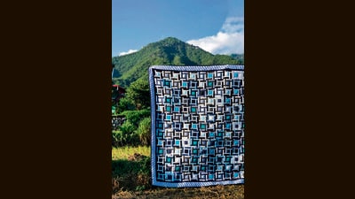The memorial quilt made from Narasimha Kini’s blue shirts. The memorial quilt made from Narasimha Kini’s blue shirts.