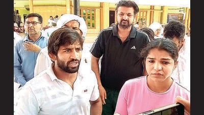 Wrestlers Bajrang Punia and Sakshi Malik in Sonepat on Saturday. (PTI) Wrestlers Bajrang Punia and Sakshi Malik in Sonepat on Saturday. (PTI)
