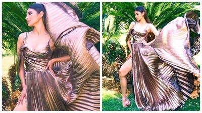Mouni Roy, the epitome of style and elegance, continues to captivate the hearts of her fans with her impeccable fashion choices. From glamorous appearances on the Cannes red carpet to breathtaking moments in a bikini against the backdrop of the Maldives, she effortlessly embraces any look with absolute perfection. Her latest appearance in a mesmerising metallic gown is yet another testament to her fashion prowess, leaving her fans in awe. (Instagram/@imouniroy) Mouni Roy, the epitome of style and elegance, continues to captivate the hearts of her fans with her impeccable fashion choices. From glamorous appearances on the Cannes red carpet to breathtaking moments in a bikini against the backdrop of the Maldives, she effortlessly embraces any look with absolute perfection. Her latest appearance in a mesmerising metallic gown is yet another testament to her fashion prowess, leaving her fans in awe. (Instagram/@imouniroy)