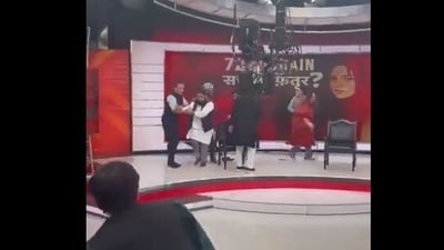 Screenshot from the viral video of Jamia scholar Shoaib Jamai being attacked during a television debate.