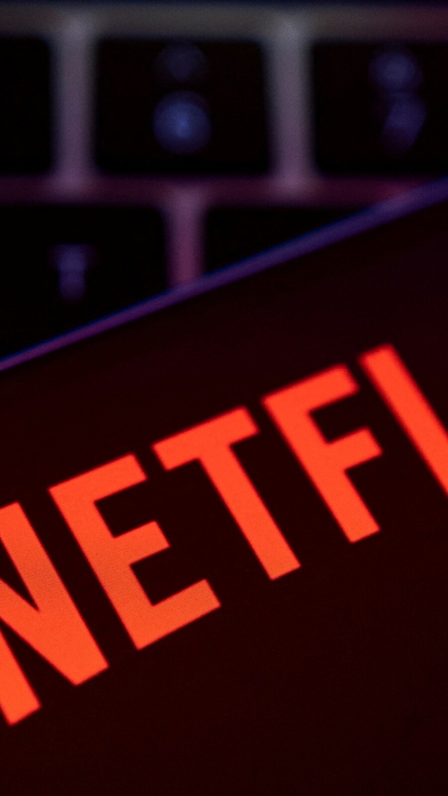 According to Netflix's new password-sharing policies, the subscribers will have to pay an extra $7.99 ( ₹658) for sharing their accounts with up to two more people living outside the household. (Reuters file photo)