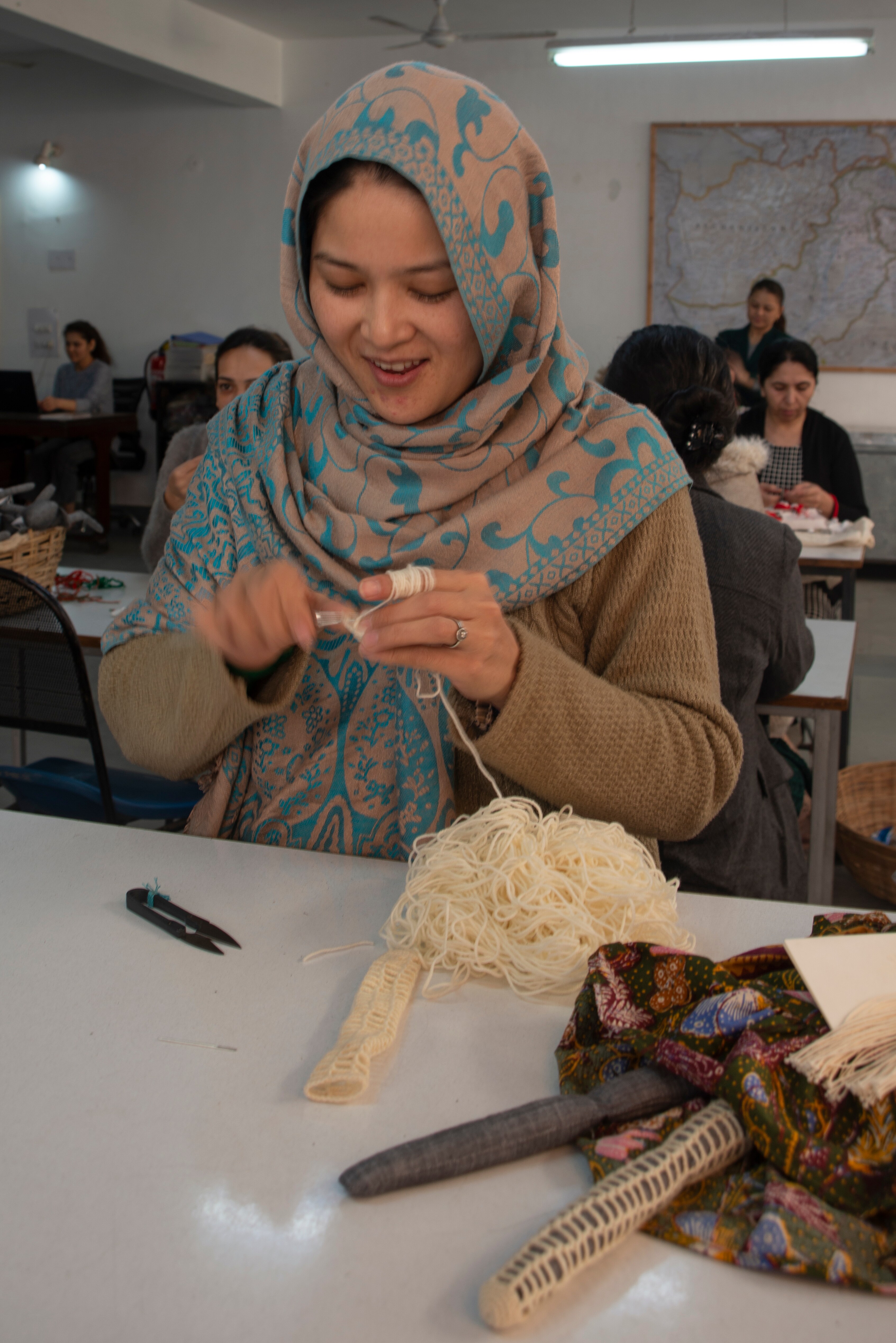 A woman from Afghan working on a Silaiwali doll at their workshop in Panchsheel Vihar, Malviya Nagar.