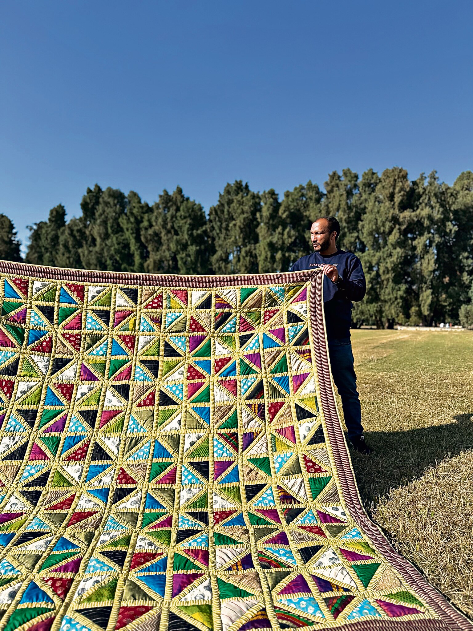 A memorial quilt featuring saris and kurtis that belonged to a Delhi woman who died in the 26/11 terror attacks. A memorial quilt featuring saris and kurtis that belonged to a Delhi woman who died in the 26/11 terror attacks.