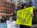 Former Indian students, facing deportation from Canada over fake documents, protest. Former Indian students, facing deportation from Canada over fake documents, protest.