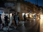 People gather in a street market late afternoon in Kabul, Afghanistan.