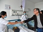 Colombia's President Gustavo Petro greets a nurse tending to one of the four Indigenous children who survived an Amazon plane crash that killed three adults and then braved the jungle for 40 days before being found alive, at a military hospital in Bogota, Colombia, Saturday, June 10, 2023. (Colombia's Press Office via AP) Colombia's President Gustavo Petro greets a nurse tending to one of the four Indigenous children who survived an Amazon plane crash that killed three adults and then braved the jungle for 40 days before being found alive, at a military hospital in Bogota, Colombia, Saturday, June 10, 2023. (Colombia's Press Office via AP)