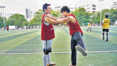 Leander Paes and Tiger Shroff warm up on the turf ground at Jamnabai Narsee School. (Sachin Haralkar)