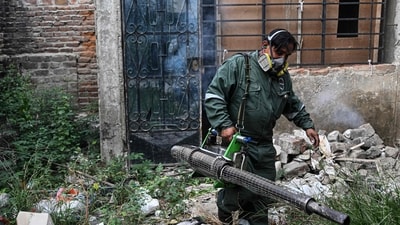 A worker fumigates a house against the Aedes aegypti mosquito to prevent the spread of dengue fever in a neighborhood in Piura, northern Peru. (AFP) A worker fumigates a house against the Aedes aegypti mosquito to prevent the spread of dengue fever in a neighborhood in Piura, northern Peru. (AFP)