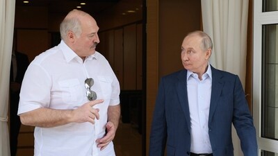 Russian president Vladimir Putin and Belarusian president Alexander Lukashenko speak. (AP)