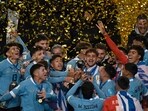 Uruguay players celebrate with the trophy after defeating Italy and winning the 2023 U-20 World Cup Uruguay players celebrate with the trophy after defeating Italy and winning the 2023 U-20 World Cup