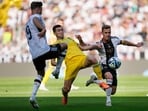 Germany's Niclas Fuellkrug, Ukraine's Taras Stepanenko and Germany's Joshua Kimmich, from left, challenge for the ball during a friendly soccer match between Germany and Ukraine in Bremen, Germany, Monday, June 12, 2023. It is the 1000st match for the German national soccer team. (AP Photo/Martin Meissner)