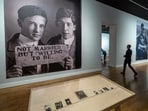 Visitors attend the preview of the Loving exhibition, which shows photographs of men in love spanning from 1850s to 1950s from a collection of Hugh Nine hugs Neal Treadwell at the Rath Museum in Geneva. 