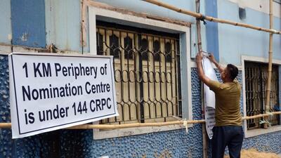 A worker ties banners outside BDO office in Serampore (ANI) A worker ties banners outside BDO office in Serampore (ANI)
