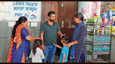 An employee collecting user fee at a public toilet at Ludhiana inter-state bus terminus on Monday. (Manish/HT) An employee collecting user fee at a public toilet at Ludhiana inter-state bus terminus on Monday. (Manish/HT)