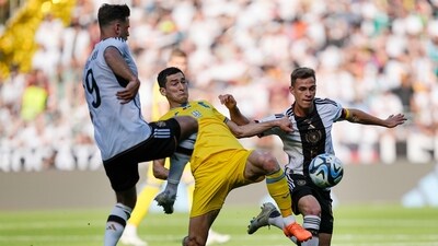 Germany's Niclas Fuellkrug, Ukraine's Taras Stepanenko and Germany's Joshua Kimmich, from left, challenge for the ball during a friendly soccer match between Germany and Ukraine in Bremen, Germany, Monday, June 12, 2023. It is the 1000st match for the German national soccer team. (AP Photo/Martin Meissner) (AP) Germany's Niclas Fuellkrug, Ukraine's Taras Stepanenko and Germany's Joshua Kimmich, from left, challenge for the ball during a friendly soccer match between Germany and Ukraine in Bremen, Germany, Monday, June 12, 2023. It is the 1000st match for the German national soccer team. (AP Photo/Martin Meissner) (AP)