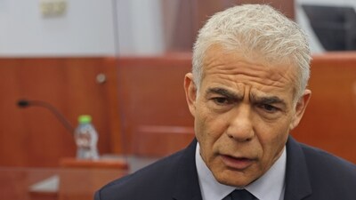 Former Israeli premier and opposition leader Yair Lapid arrives to testify in the corruption trial of Prime Minister Benjamin Netanyahu before Jerusalem's District Court. (AFP) Former Israeli premier and opposition leader Yair Lapid arrives to testify in the corruption trial of Prime Minister Benjamin Netanyahu before Jerusalem's District Court. (AFP)