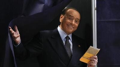 Silvio Berlusconi comes out of a voting booth before casting his ballot at a polling station in Milan, Italy, on September 25, 2022. (AP) Silvio Berlusconi comes out of a voting booth before casting his ballot at a polling station in Milan, Italy, on September 25, 2022. (AP)