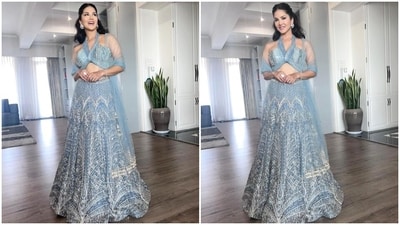 The halter-neck blouse features a plunging neckline and back, intricate embellishments, a cropped midriff-baring asymmetric hem, and a fitted bust. Sunny styled it with a matching lehenga skirt featuring a layered ghera, high-rise waist, and matching sequin work. (Instagram) The halter-neck blouse features a plunging neckline and back, intricate embellishments, a cropped midriff-baring asymmetric hem, and a fitted bust. Sunny styled it with a matching lehenga skirt featuring a layered ghera, high-rise waist, and matching sequin work. (Instagram)