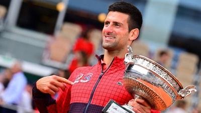 Novak Djokovic shows the number 23, number of Grand Slam titles won, as he celebrated a 3rd French Open title. (AFP) Novak Djokovic shows the number 23, number of Grand Slam titles won, as he celebrated a 3rd French Open title. (AFP)