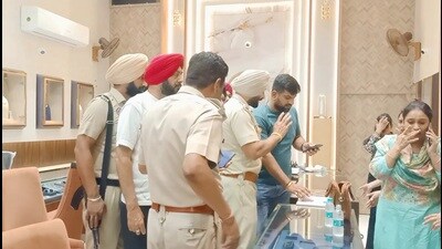 The police outside the shop in Moga on Monday. (HT photo) The police outside the shop in Moga on Monday. (HT photo)
