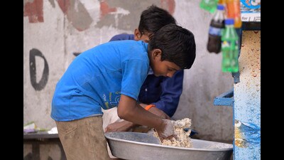 While kids his age go to school, 11-year-old Guddu is forced to work at food joints to earn two square meals a day. (HT Photo) While kids his age go to school, 11-year-old Guddu is forced to work at food joints to earn two square meals a day. (HT Photo)